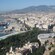 A large city near mountains and a port